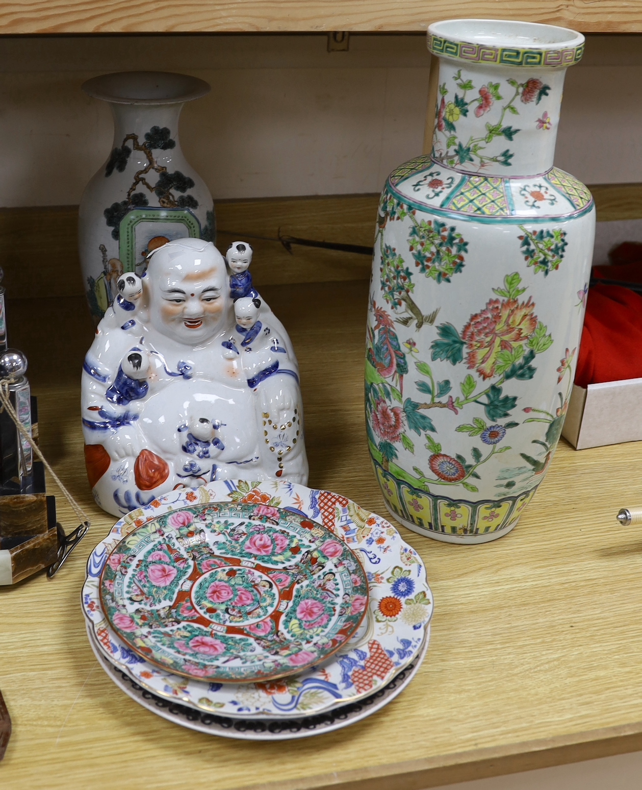 Two Chinese vases, three plates and a figure of Budai, tallest vase 44cm